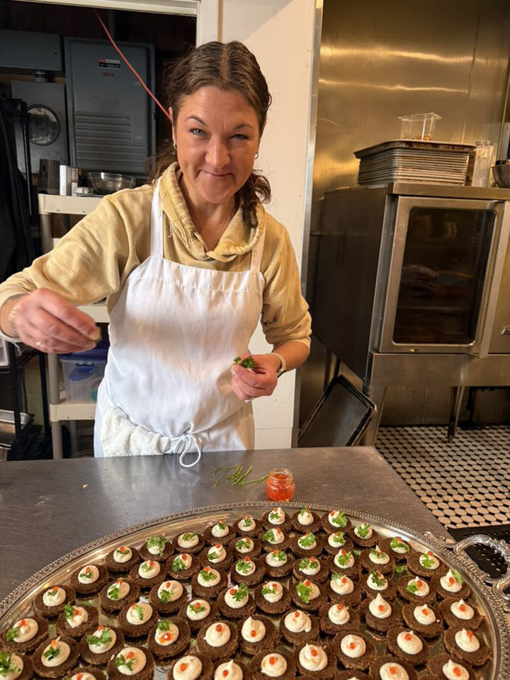 Chef Anthony Draganowski preparing a dish in Bijou Bistro's European-style kitchen