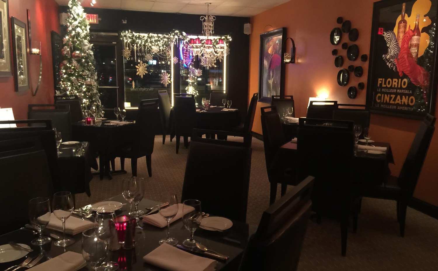 Bijou Bistro intimate dining room with elegant table settings and warm ambiance
